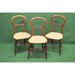 Set of three rosewood side chairs having hooped backs with carved back rails,