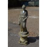 20th century statue of a young lady holding water jug,