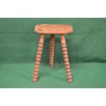 Pine milking stool having rectangular top with cut corners supported on three outward splayed