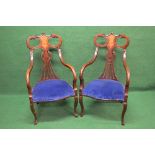 Pair of Edwardian mahogany inlaid open armchairs having pierced back splats over shaped padded