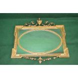 Gilt framed wall mirror having central oval bevelled mirror surmounted by a further mirrored border
