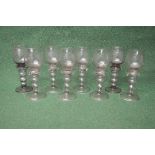 Group of eight smoked Roemer glasses to comprise: six matching and two similar each having engraved