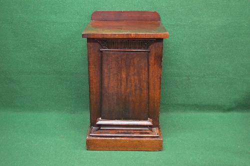 19th century mahogany pedestal side cabinet the top having raised back over panelled door opening