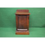 19th century mahogany pedestal side cabinet the top having raised back over panelled door opening