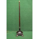 Mahogany standard lamp having turned column leading to a square formed base with gadrooned border,