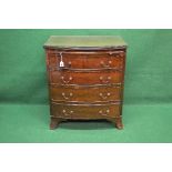 Mahogany bow fronted chest of drawers the top having reeded edge over pull out brushing slide and