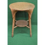 Circular Lloyd Loom two tier occasional table the lower tier supported by four stretchers and