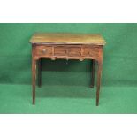 Mahogany side table having rounded corners with central drawer flanked by smaller drawers with