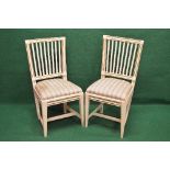 Pair of 19th century cream painted side chairs having reeded top rails over vertical reeded back