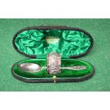 Cased silver spoon, marked for Sheffield together with a silver napkin ring, marked for Chester,