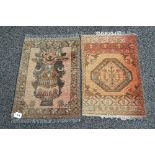 Two small brown ground rugs having brown and black pattern with end tassels - 17" x 26" each