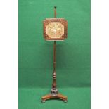 19th century rosewood pole screen with fretwork screen frame housing floral needlework,