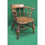 Victorian captains chair having scrolled back and arms supported by turned spindles leading to a