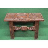 African carved occasional table the top being carved with figure, snakes,