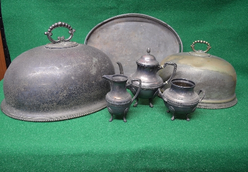 Two oval silver plated meat covers together with an oval plated two handled serving tray with