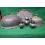 Two oval silver plated meat covers together with an oval plated two handled serving tray with