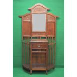 Late 20th century hardwood hall stand having arched top over carved panel and bevelled mirror