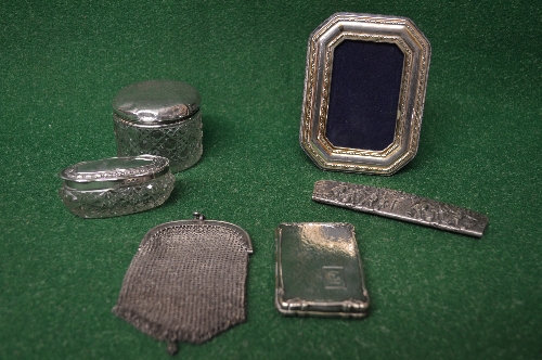 Group of silver and white metal items to compise: two glass silver topped dressing table pots,