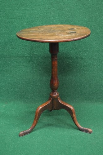 19th century mahogany tip top occasional table having circular top supported on a turned column