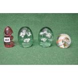Two Victorian green glass flower dump paperweights together with an Avondale glass paperweight and