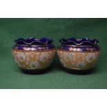 Pair of Royal Doulton blue ground jardinieres having fluted top with gilt border,