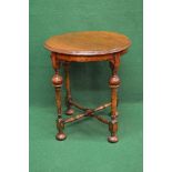Circular oak occasional table the top having moulded edge supported on four turned legs with lower