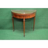 Mahogany demi lune fold over card table having inlaid and cross banded top opening to reveal green