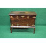 Mahogany chest on stand having brass mounts, escutcheon and side carrying handles,