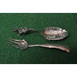 Dutch silver spoon having scrolled handle with applied decoration and embossed bowl having scene of