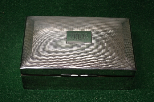 Silver cigarette box having engine turned decoration and personalised initial engraving,