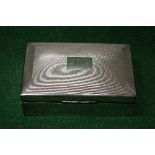 Silver cigarette box having engine turned decoration and personalised initial engraving,