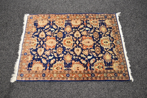 Blue ground rug having brown and cream pattern with end tassels - 40" x 56"