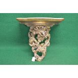 Gilt wood wall bracket the shelf having serpentine front over a scrolled carved support - 17" wide