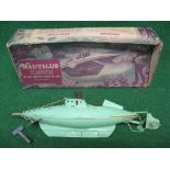 1955 Sutcliffe tinplate clockwork Nautilus submarine in green with rubber bung, key and lidded