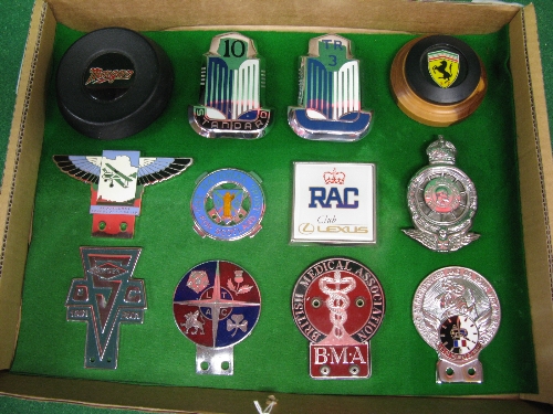 Twelve car badges etc to include: BMA, Le Mans 24 Hr St Christopher, Singer Owners Club,