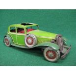 Large Mettoy tinplate clockwork Sedan finished in green with cream lining, includes: driver, sliding