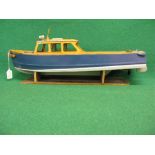 Bespoke wooden model of a classic shaped open backed motor launch with rudder, prop and stand (power
