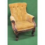 Victorian mahogany armchair having buttoned back supported by scrolled arms leading to padded
