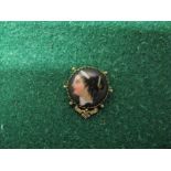 19th century possibly French circular brooch with gold surround, the porcelain disk hand painted