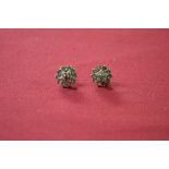 Pair of 9ct gold Emerald and Diamond cluster ear studs each mounted with a circular cut Emerald to