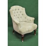 Button back green tub armchair having scrolled arms, over stuffed seat and shaped front, standing on
