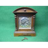 Mahogany cased mantle clock having silvered dial with black numerals and black metal hands, standing