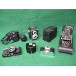 Group of seven cameras to include: Yashica TL-Electro, Halina Perfect, Konica Autoreflex TC, Kodak