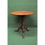 19th century mahogany circular tip top occasional table the top having raised moulded edge and