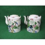 Pair of large Oriental teapots having floral decoration with birds and cord handle (one handle