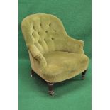 Victorian button back tub chair having scrolled arms and standing on turned legs ending in castors