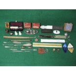 Tray of collectables to include: spring balance, burnishing tool, razor, cased part set of studs,