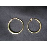 Pair of 9ct gold earrings of hoop form set with single row of circular cut diamonds (gross weight