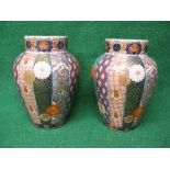 Pair of Oriental bulbous ribbed vases having brightly coloured decorated panels and red back stamp -