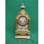 8 day gilt metal ormolu mantle clock having painted porcelain dial with black Roman Numerals and